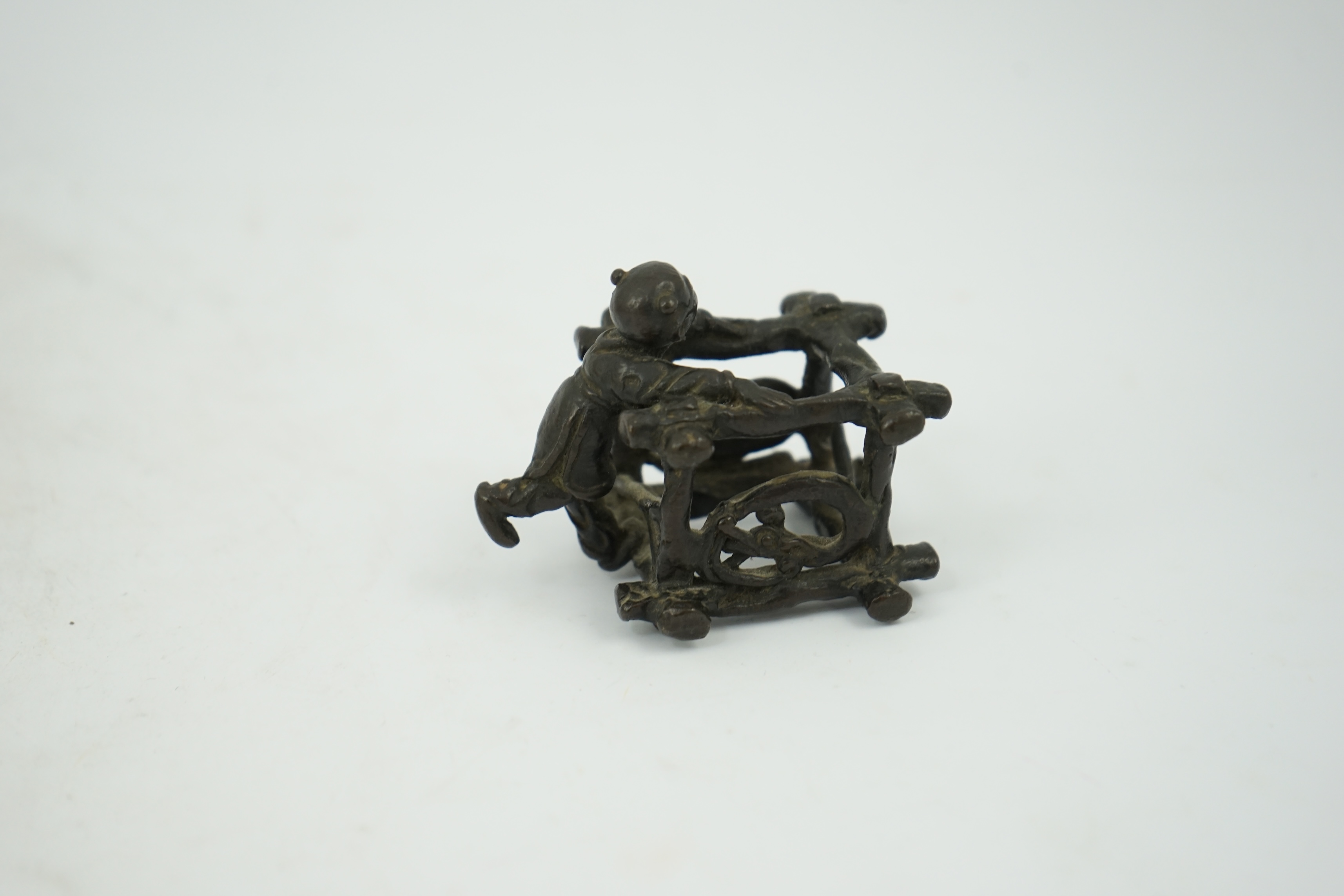 A Chinese bronze figural scroll weight, late Ming